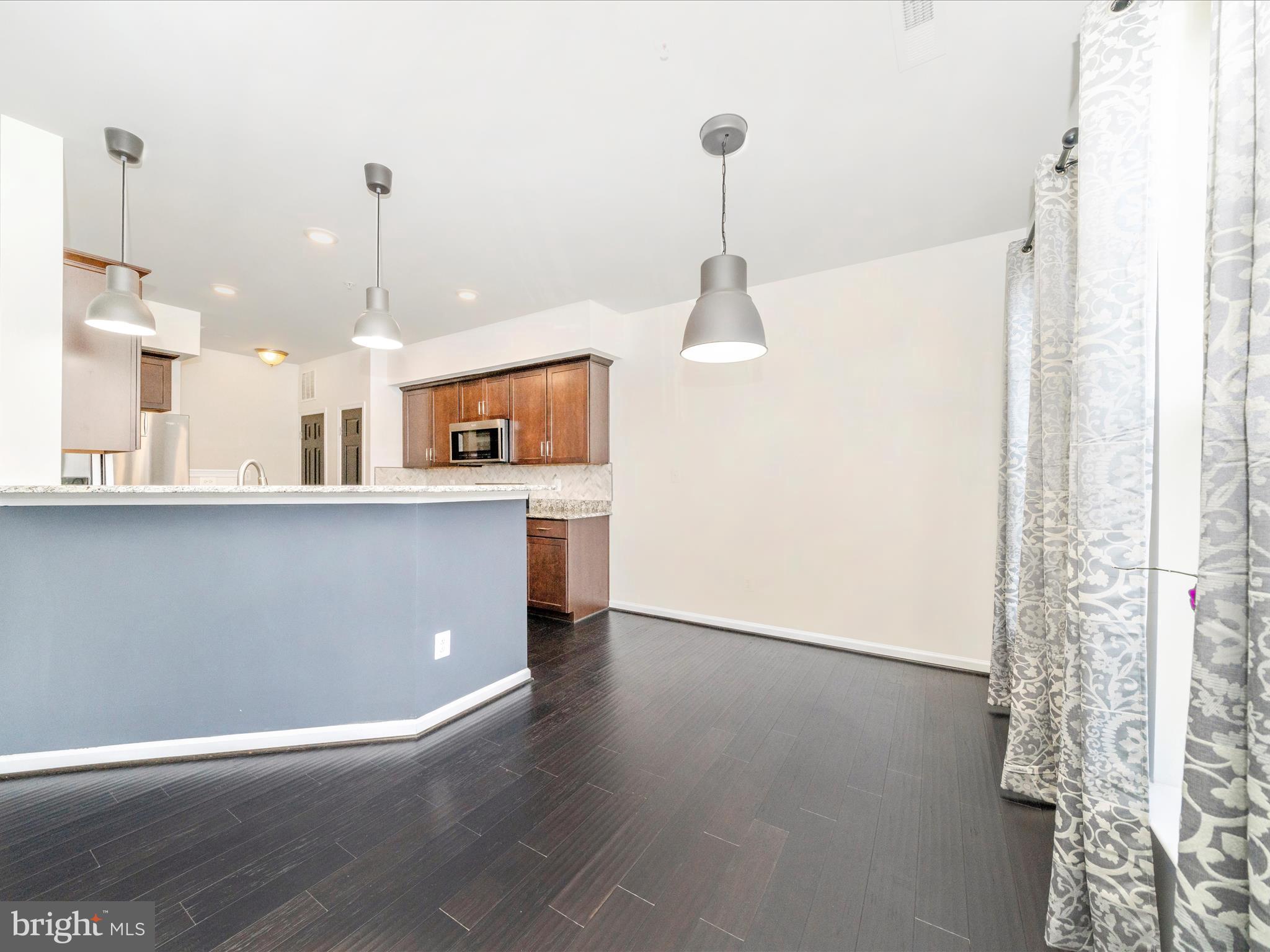 5880 Imperial Drive Frederick, MD 21703 - Photo 16 of 54 a view of a kitchen with furniture and wooden floor