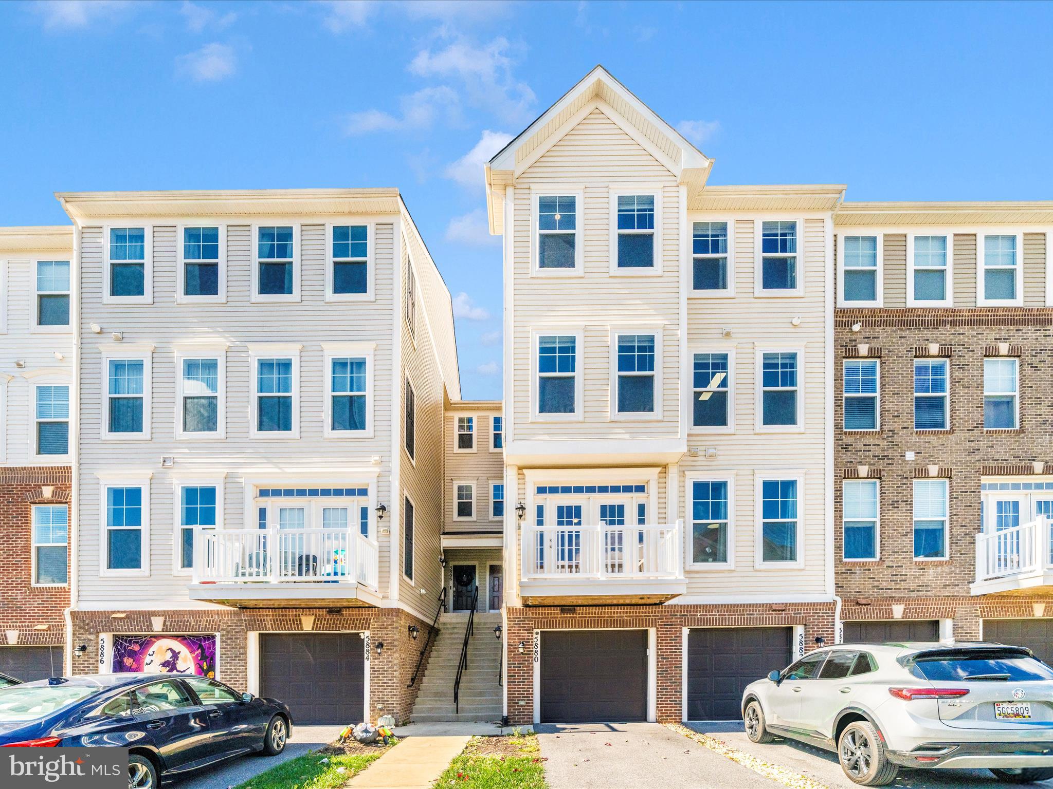 5880 Imperial Drive Frederick, MD 21703 - Photo 2 of 54 a front view of a residential apartment building with a yard