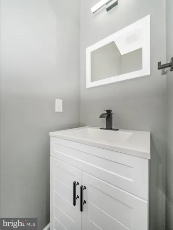 a view of a kitchen with a sink and a window