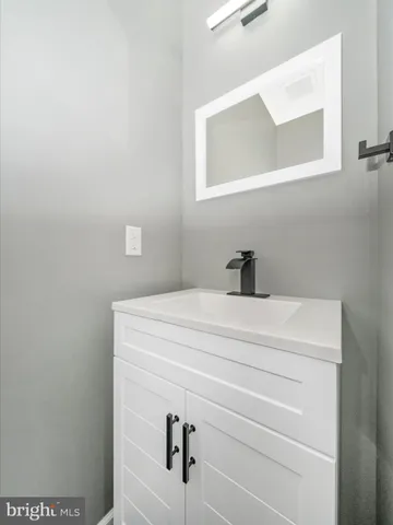 a view of a kitchen with a sink and a window
