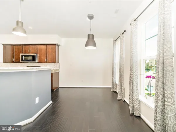a view of a kitchen with a sink and a window
