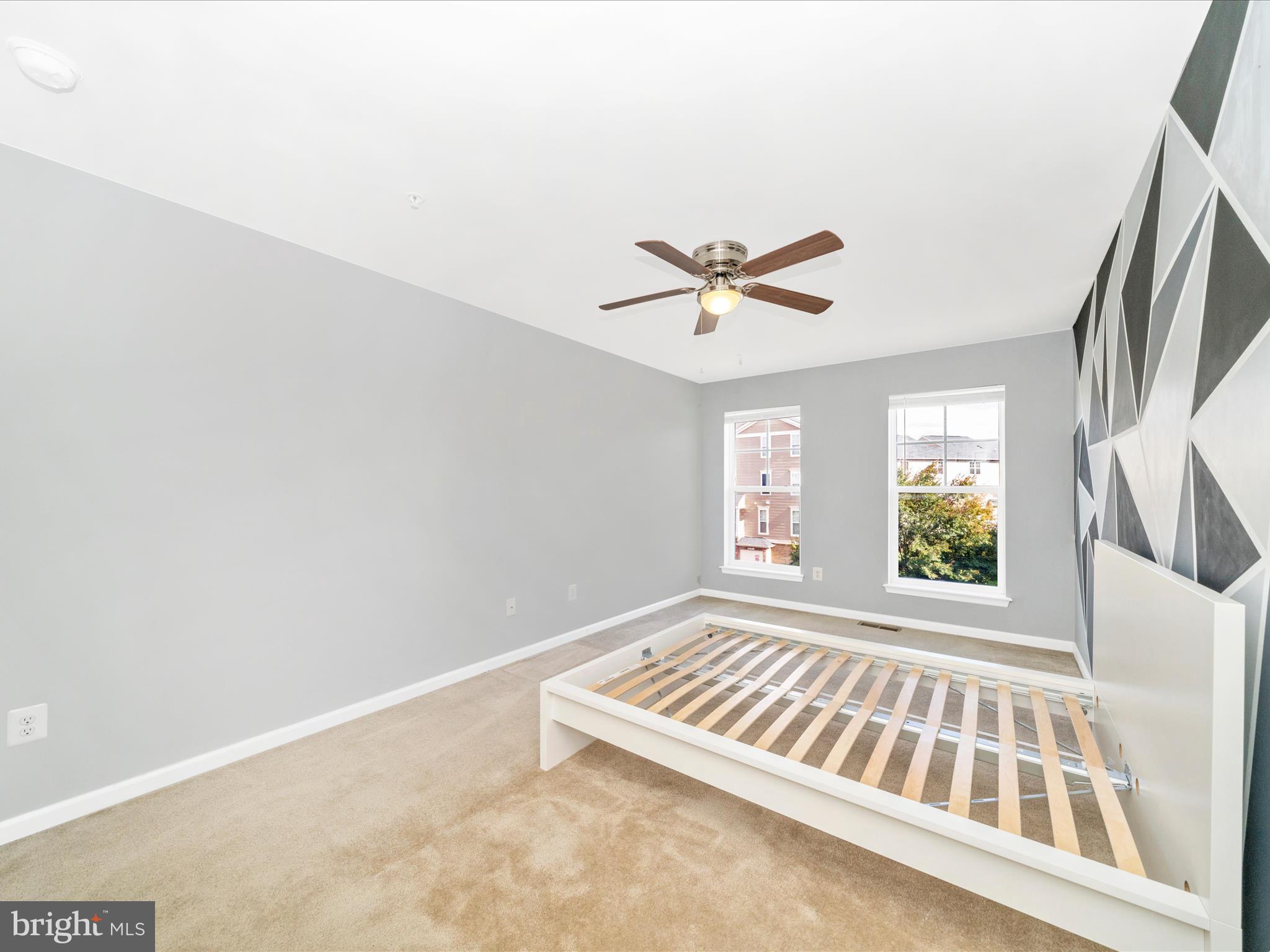 5880 Imperial Drive Frederick, MD 21703 - Photo 35 of 54 an empty room with windows and fan