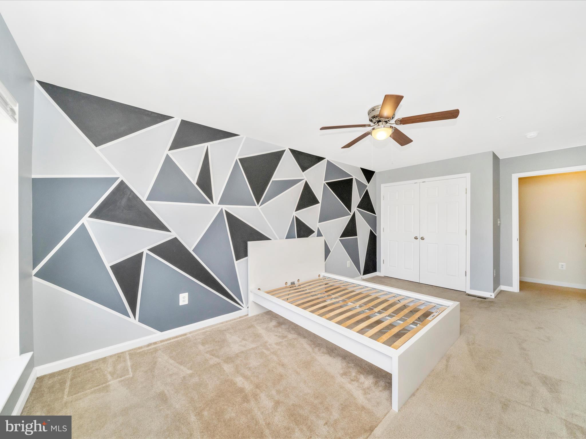 5880 Imperial Drive Frederick, MD 21703 - Photo 36 of 54 an empty room with windows and ceiling fan