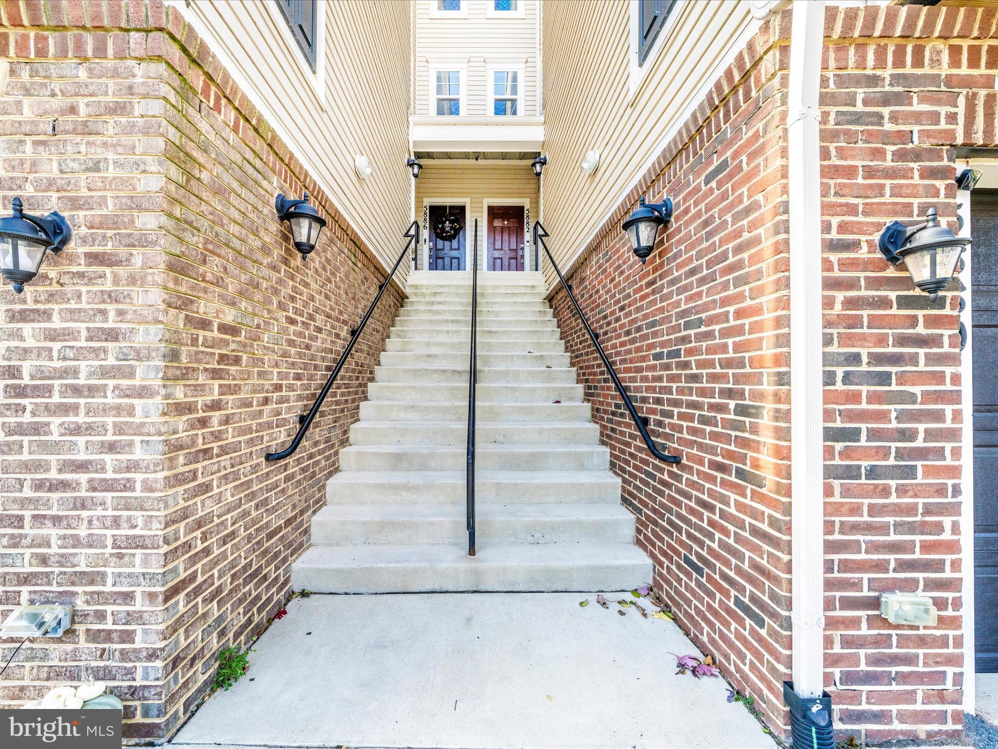 5880 Imperial Drive Frederick, MD 21703 - Photo 6 of 54 a view of stairs with wooden floor and windows