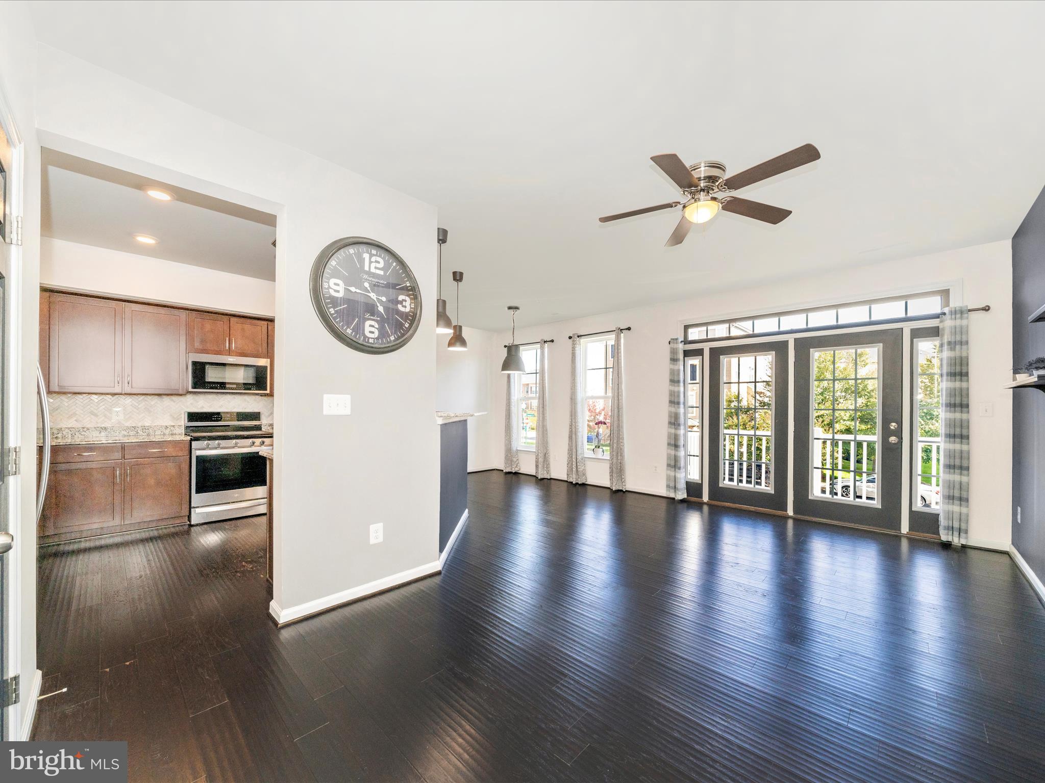 5880 Imperial Drive Frederick, MD 21703 - Photo 10 of 54 a view of an empty room with a window and wooden floor