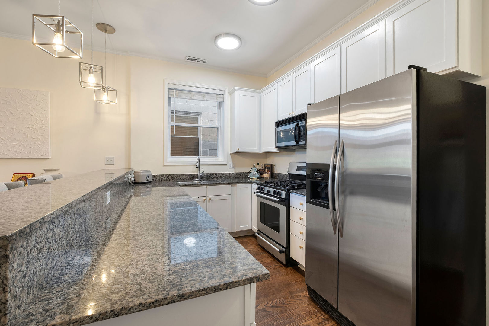 1529 West Montana Street, Unit 2 Chicago, IL 60614 - Photo 15 of 32 a kitchen with granite countertop a refrigerator and a sink