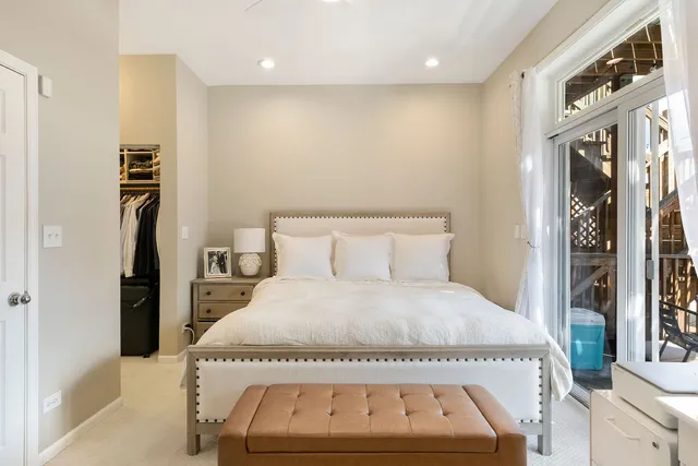 a large white bed in a white room