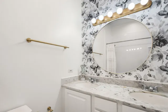 a bathroom with a sink and mirror
