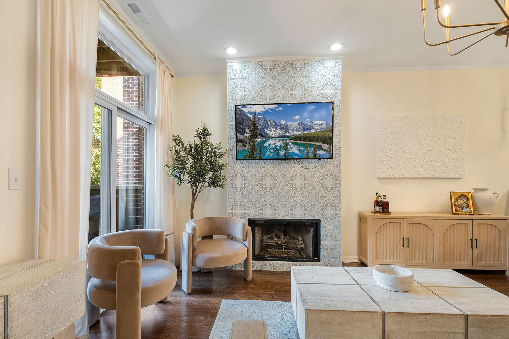 1529 West Montana Street, Unit 2 Chicago, IL 60614 - Photo 5 of 32 a living room with furniture a flat screen tv and a fireplace