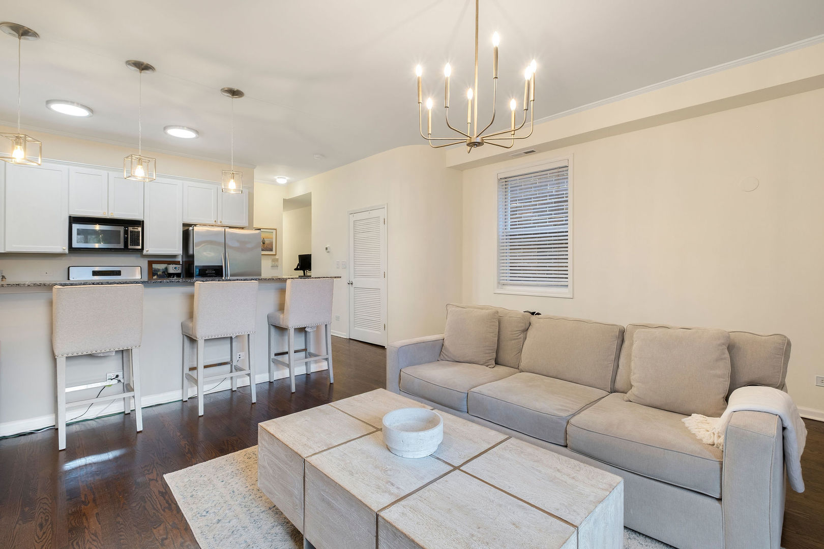 1529 West Montana Street, Unit 2 Chicago, IL 60614 - Photo 9 of 32 a living room with furniture kitchen and a chandelier