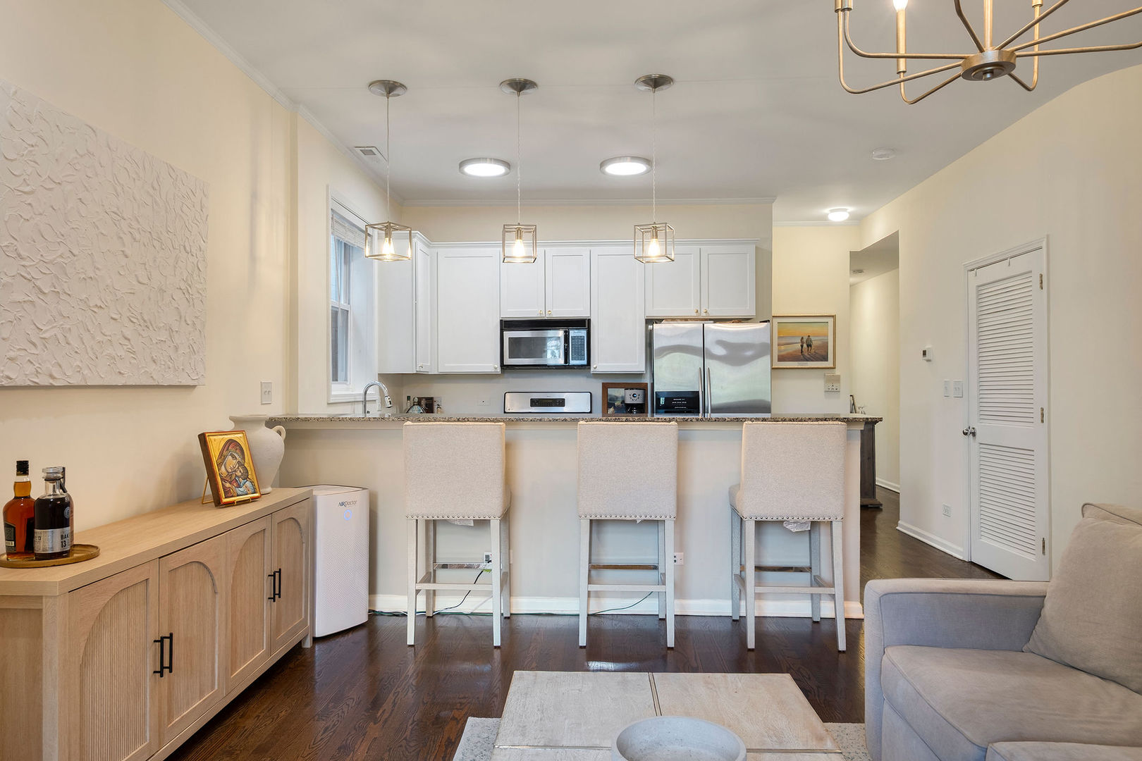 1529 West Montana Street, Unit 2 Chicago, IL 60614 - Photo 10 of 32 a kitchen with white cabinets and stainless steel appliances