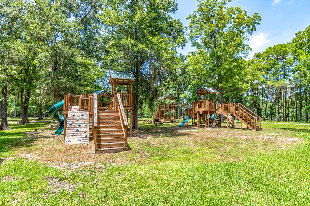 129 Shoreline Drive Cleveland, TX 77327 - Photo 15 of 22 a view of a house with a yard and sitting area