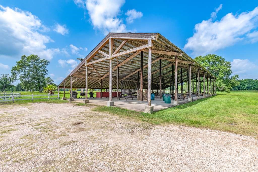 129 Shoreline Drive Cleveland, TX 77327 - Photo 17 of 22 a view of a house with a yard