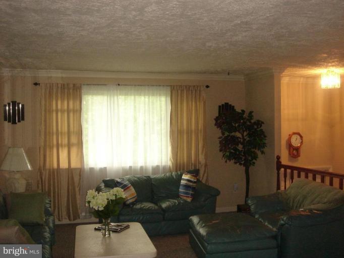 4018 Winlee Road Randallstown, MD 21133 - Photo 4 of 5 a living room with furniture and a large window