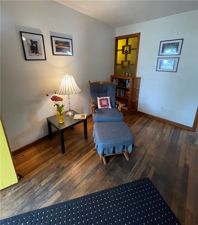 360 Ridge Street Piqua, OH 45356 - Photo 7 of 46 This inviting reading nook features rich hardwood flooring and a charming built-in bookcase.
