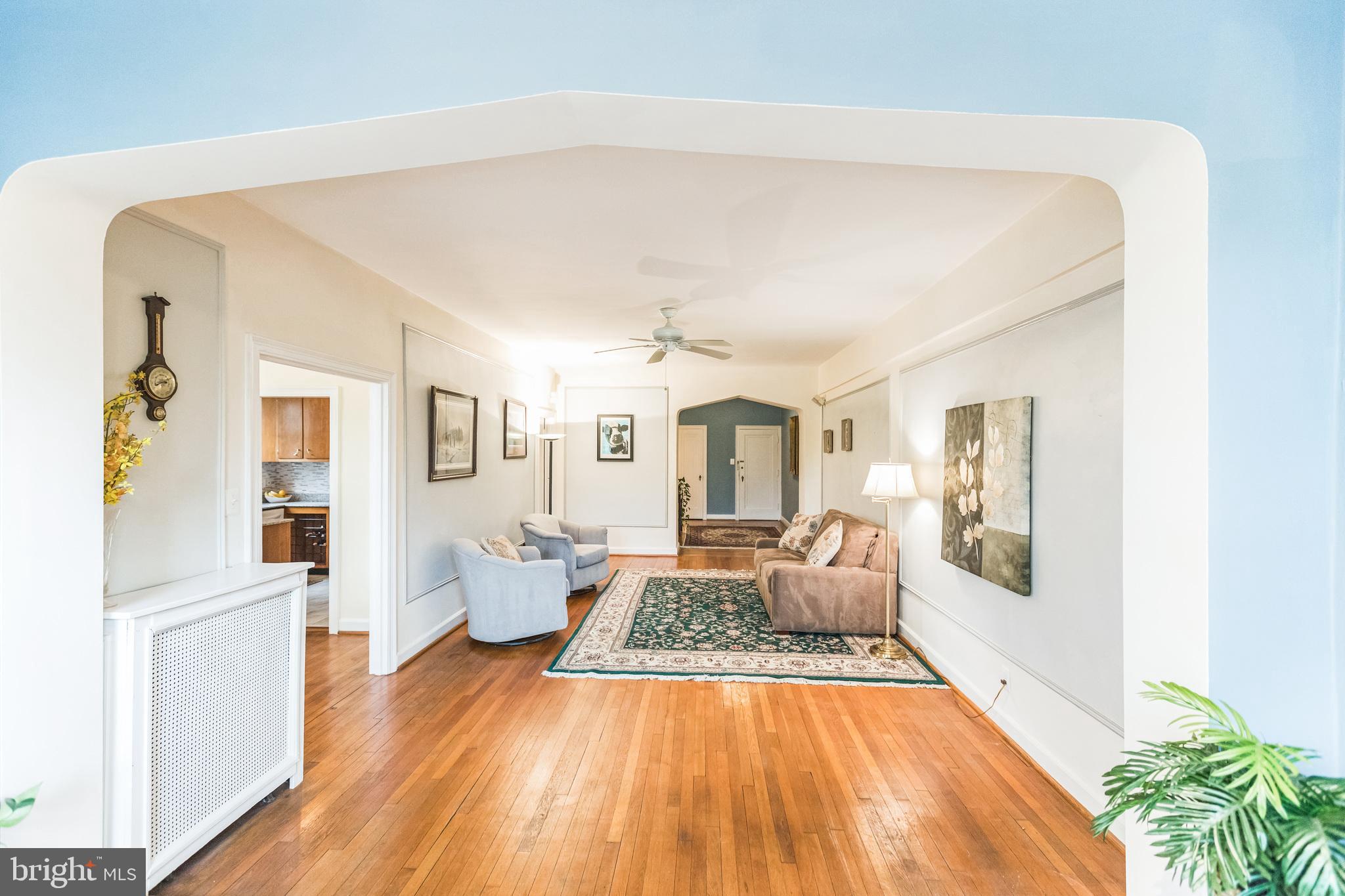2737 Devonshire Place Northwest, Unit 7 Washington, DC 20008 - Photo 13 of 36 a spacious bedroom with a bed and wooden floor