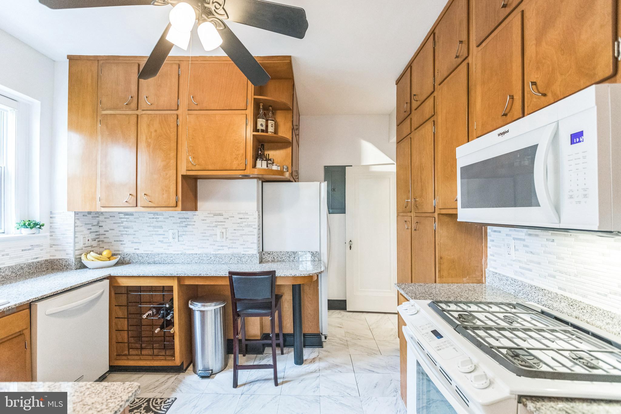 2737 Devonshire Place Northwest, Unit 7 Washington, DC 20008 - Photo 16 of 36 a kitchen with a sink and a stove top oven