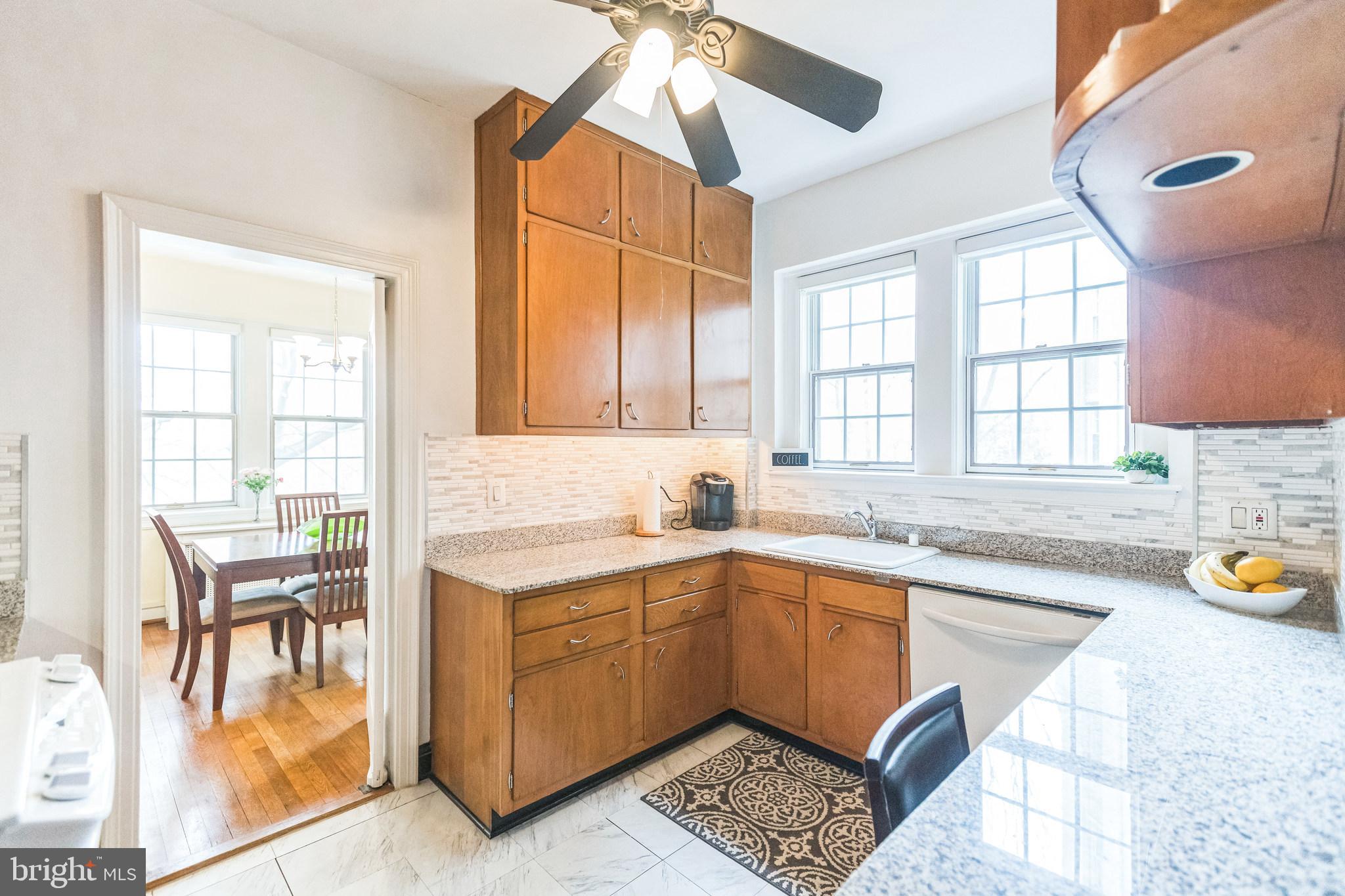 2737 Devonshire Place Northwest, Unit 7 Washington, DC 20008 - Photo 18 of 36 a kitchen with a sink and a stove top oven