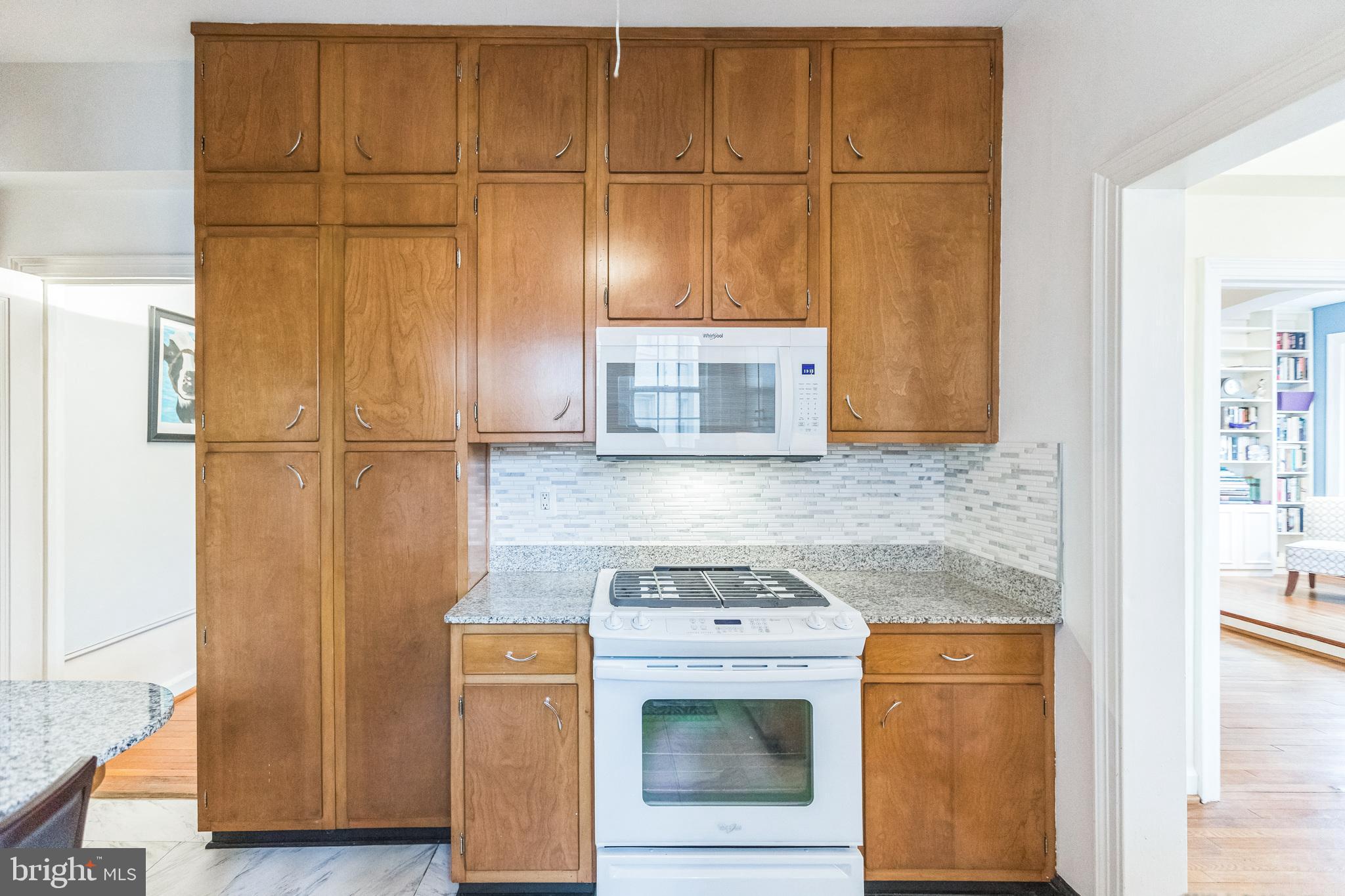 2737 Devonshire Place Northwest, Unit 7 Washington, DC 20008 - Photo 19 of 36 a kitchen with stainless steel appliances granite countertop a stove and a refrigerator
