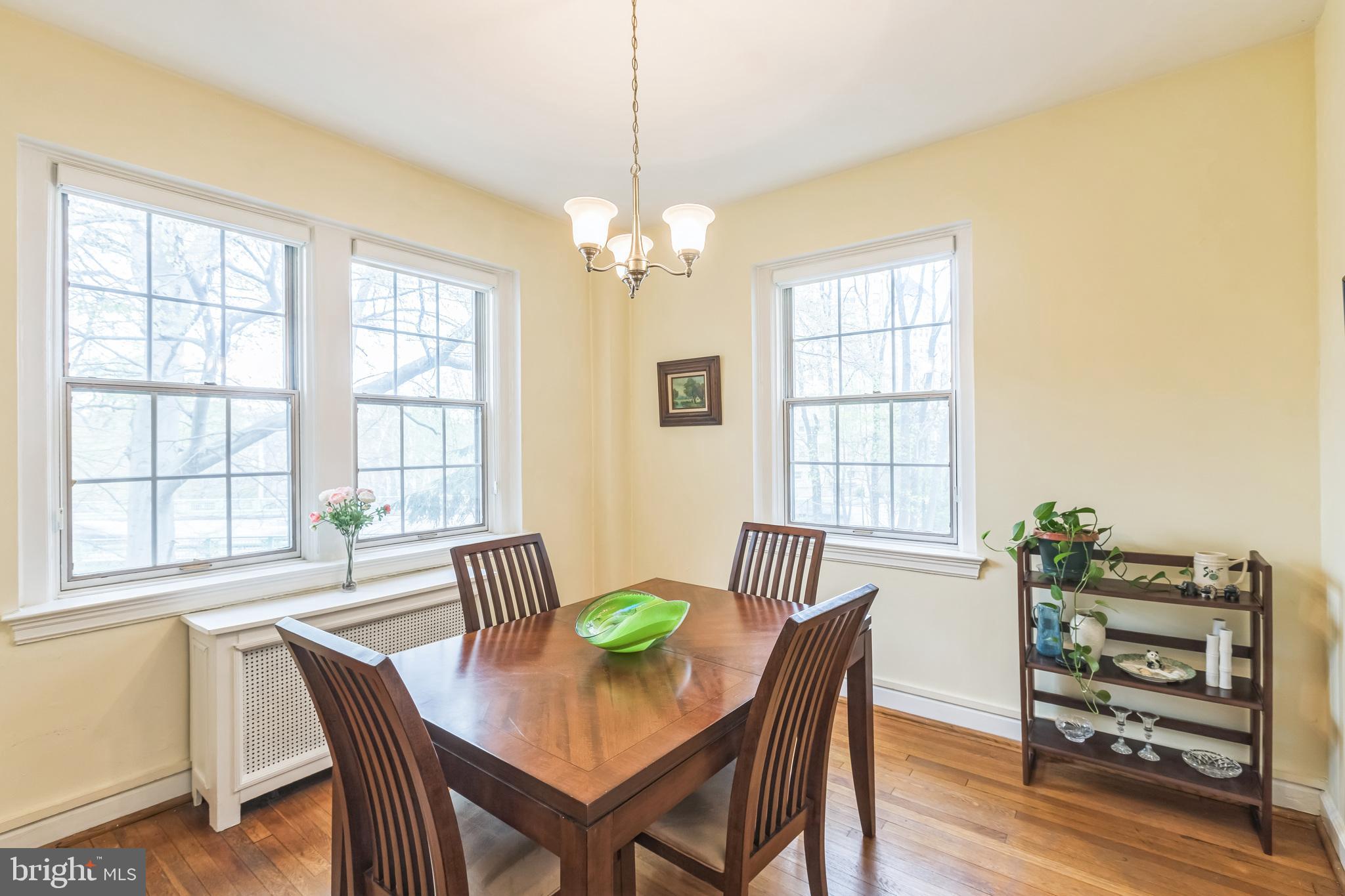2737 Devonshire Place Northwest, Unit 7 Washington, DC 20008 - Photo 20 of 36 a view of a dining room with furniture window and wooden floor