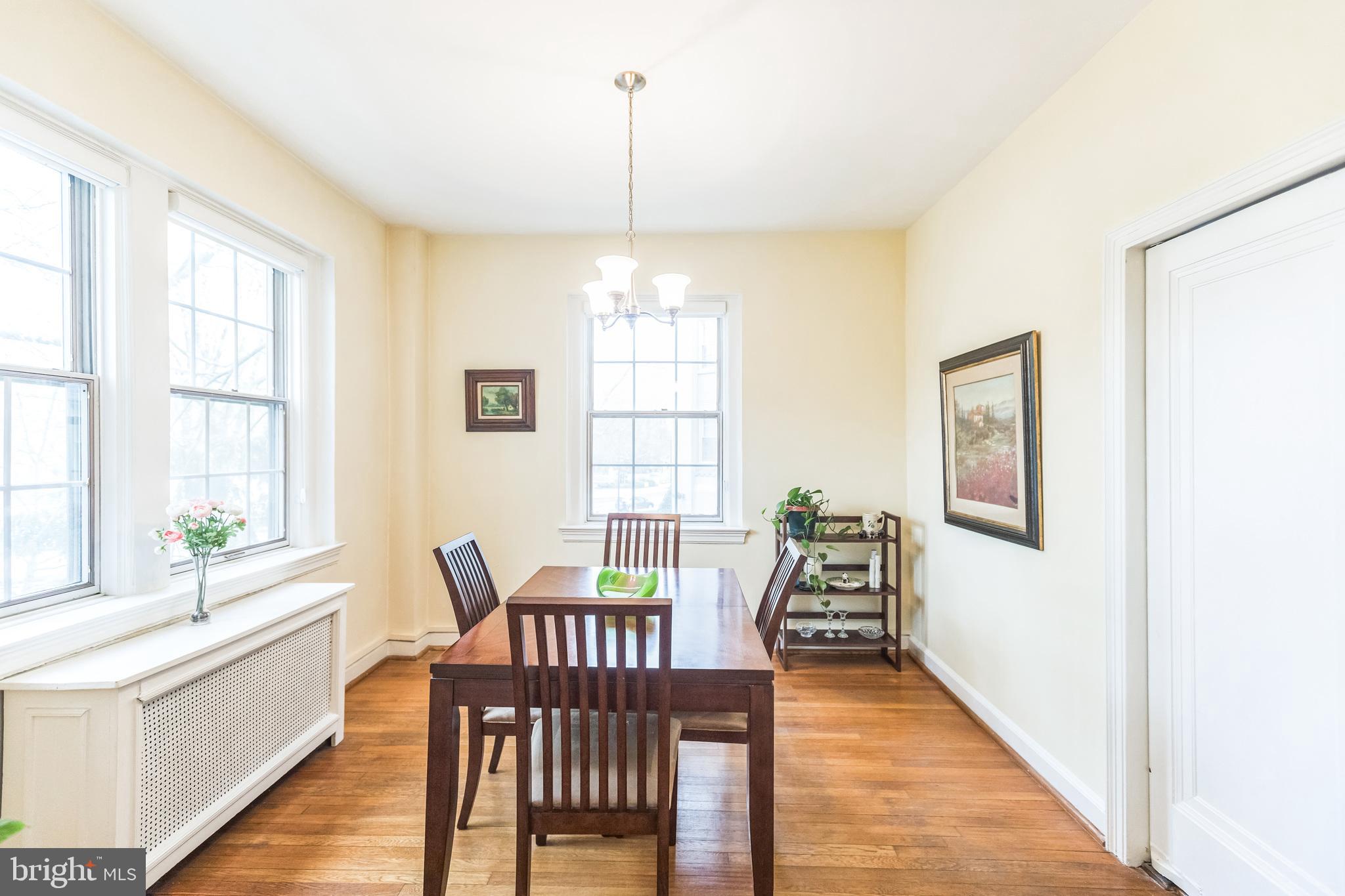 2737 Devonshire Place Northwest, Unit 7 Washington, DC 20008 - Photo 21 of 36 a view of a dining room with furniture windows and wooden floor