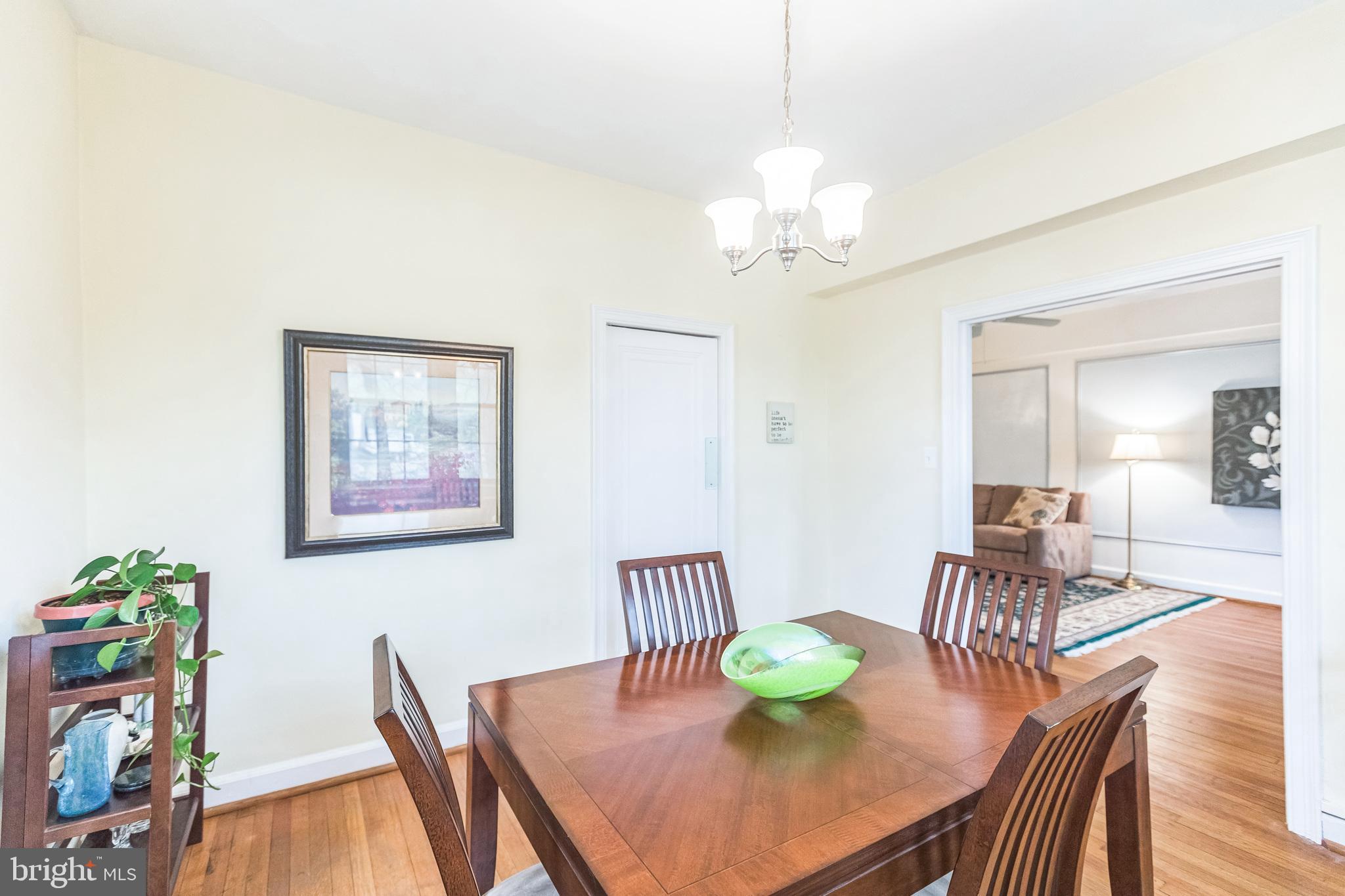 2737 Devonshire Place Northwest, Unit 7 Washington, DC 20008 - Photo 22 of 36 a view of a dining room with furniture and wooden floor