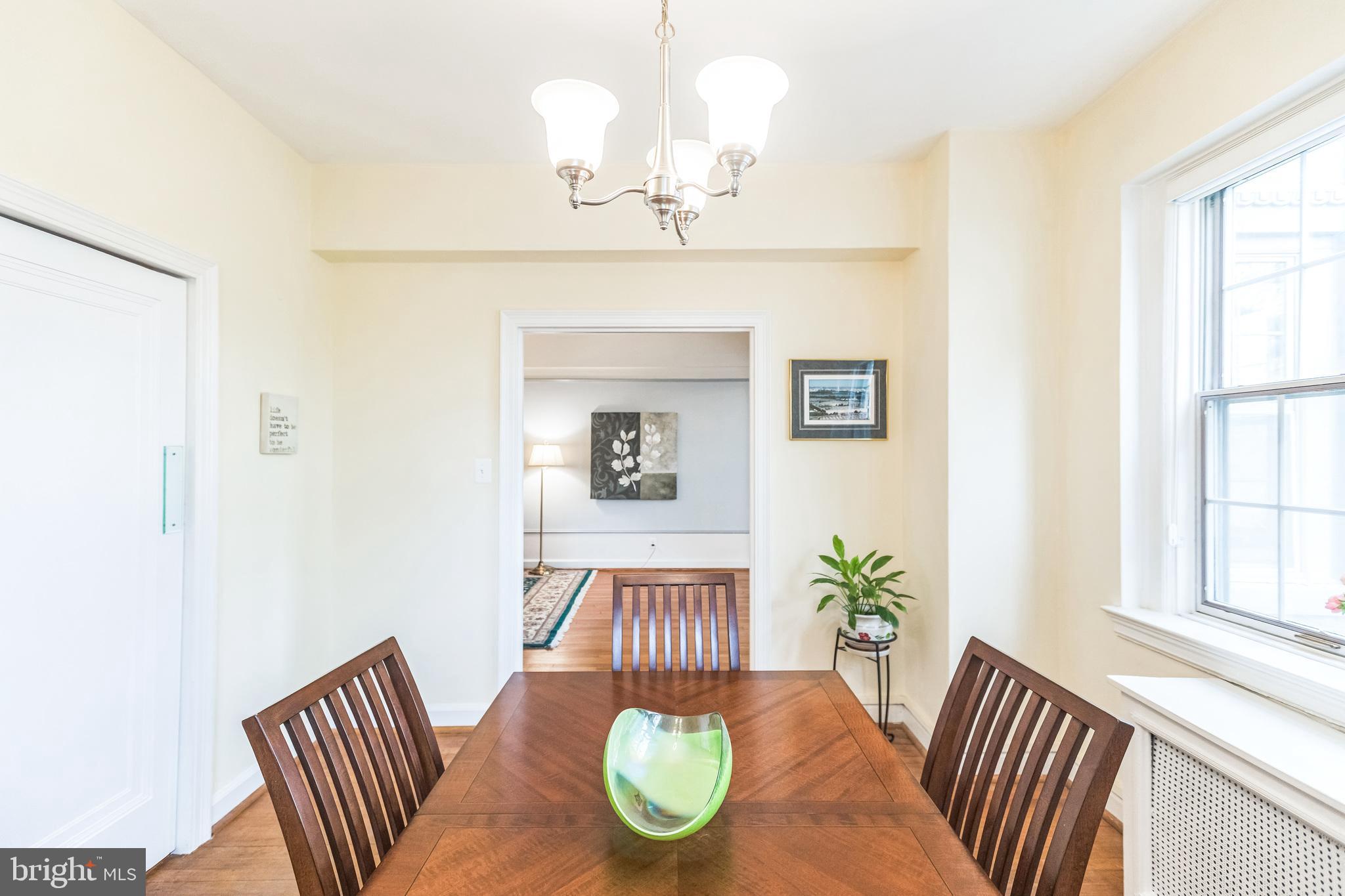 2737 Devonshire Place Northwest, Unit 7 Washington, DC 20008 - Photo 23 of 36 a view of a dining room with furniture wooden floor and chandelier