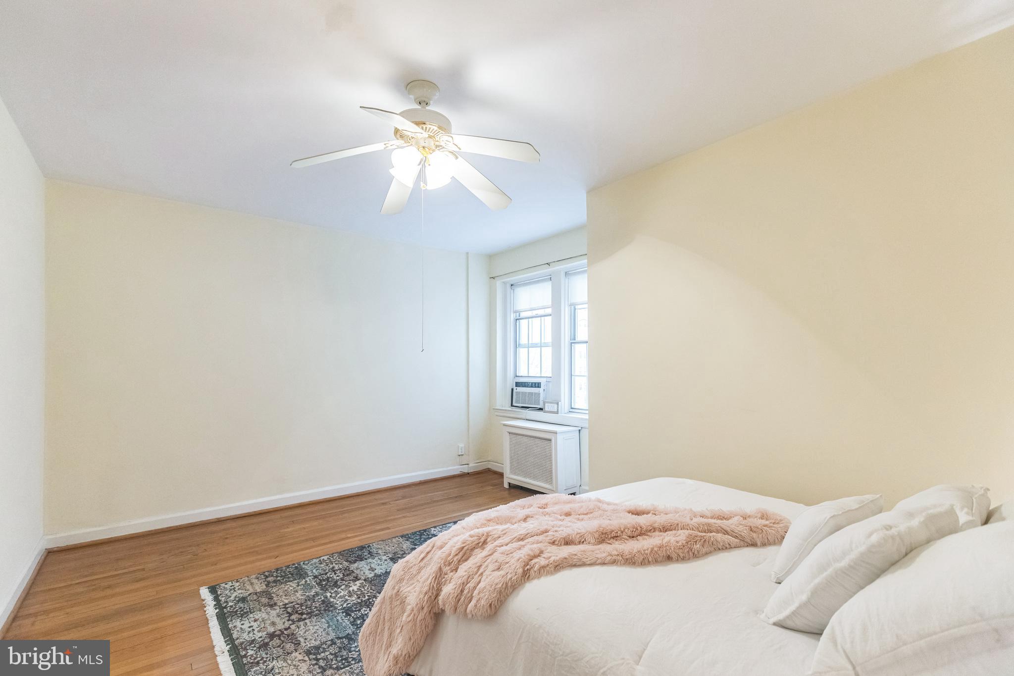 2737 Devonshire Place Northwest, Unit 7 Washington, DC 20008 - Photo 26 of 36 a bedroom with a bed and a window