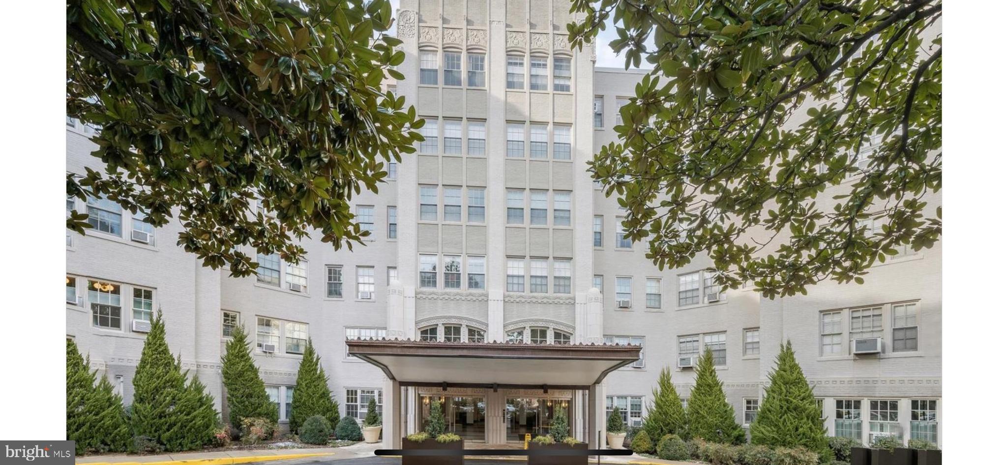 2737 Devonshire Place Northwest, Unit 7 Washington, DC 20008 - Photo 3 of 36 a front view of a building with large trees and plants