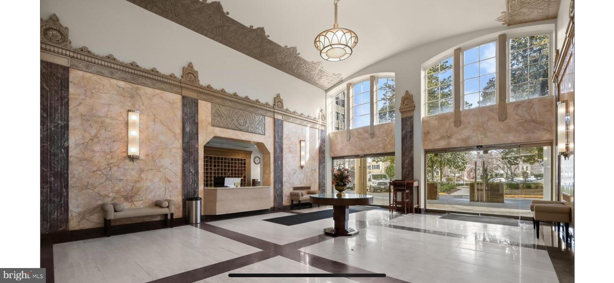 2737 Devonshire Place Northwest, Unit 7 Washington, DC 20008 - Photo 4 of 36 a view of a hallway with a glass door and furniture