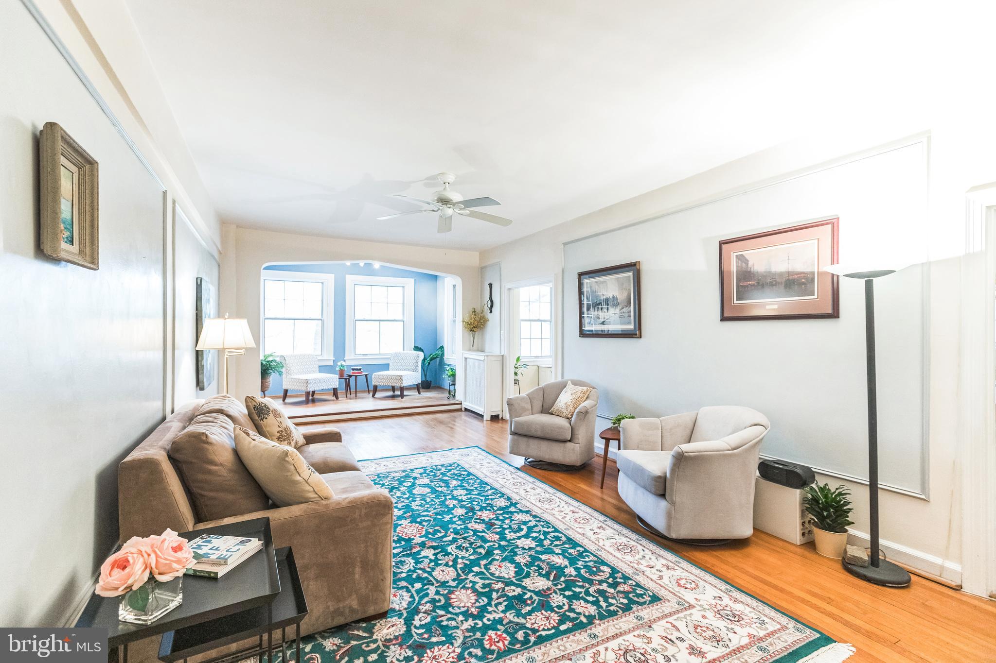 2737 Devonshire Place Northwest, Unit 7 Washington, DC 20008 - Photo 8 of 36 a living room with furniture and a rug