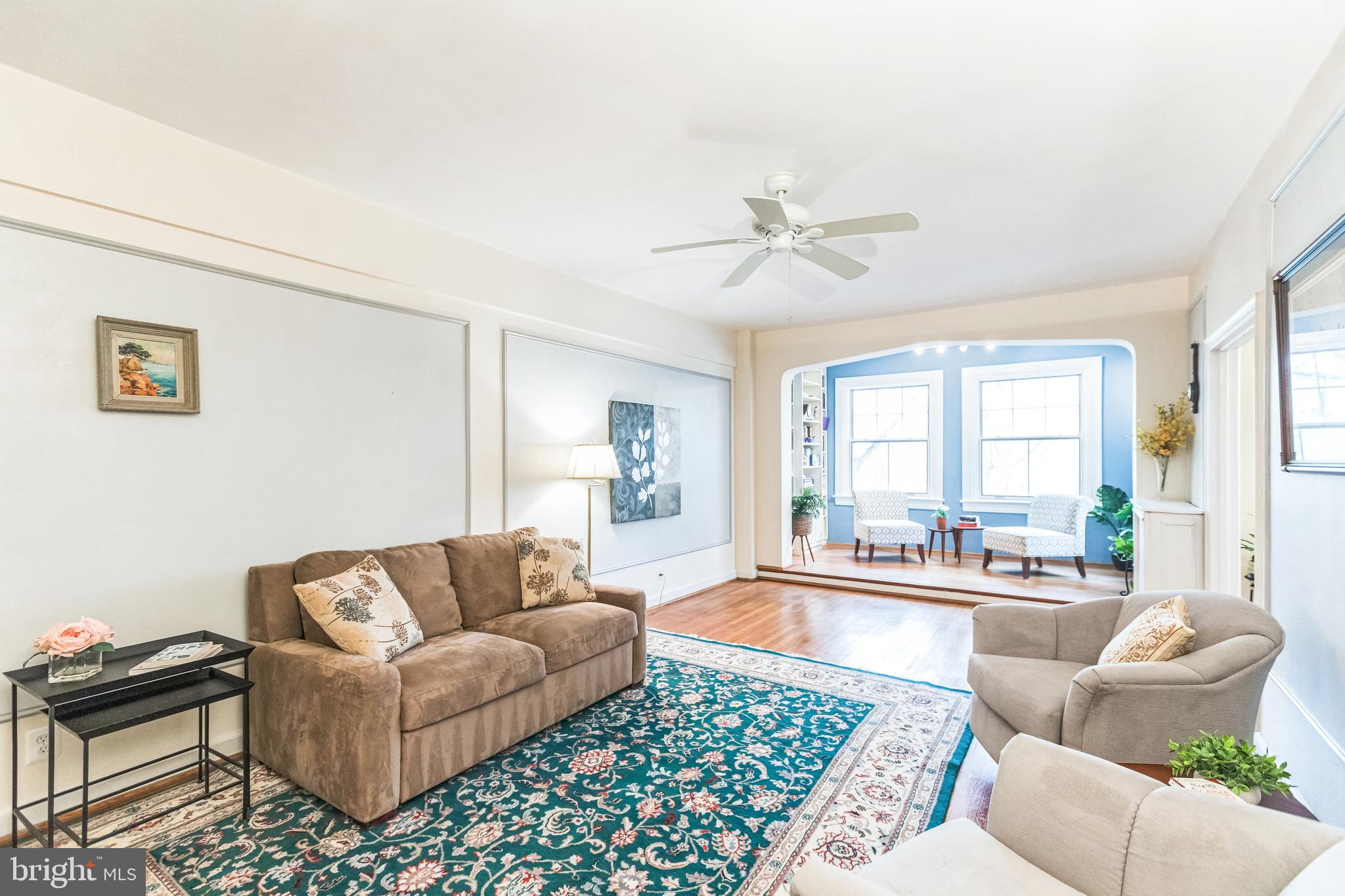 2737 Devonshire Place Northwest, Unit 7 Washington, DC 20008 - Photo 9 of 36 a living room with furniture and a large window
