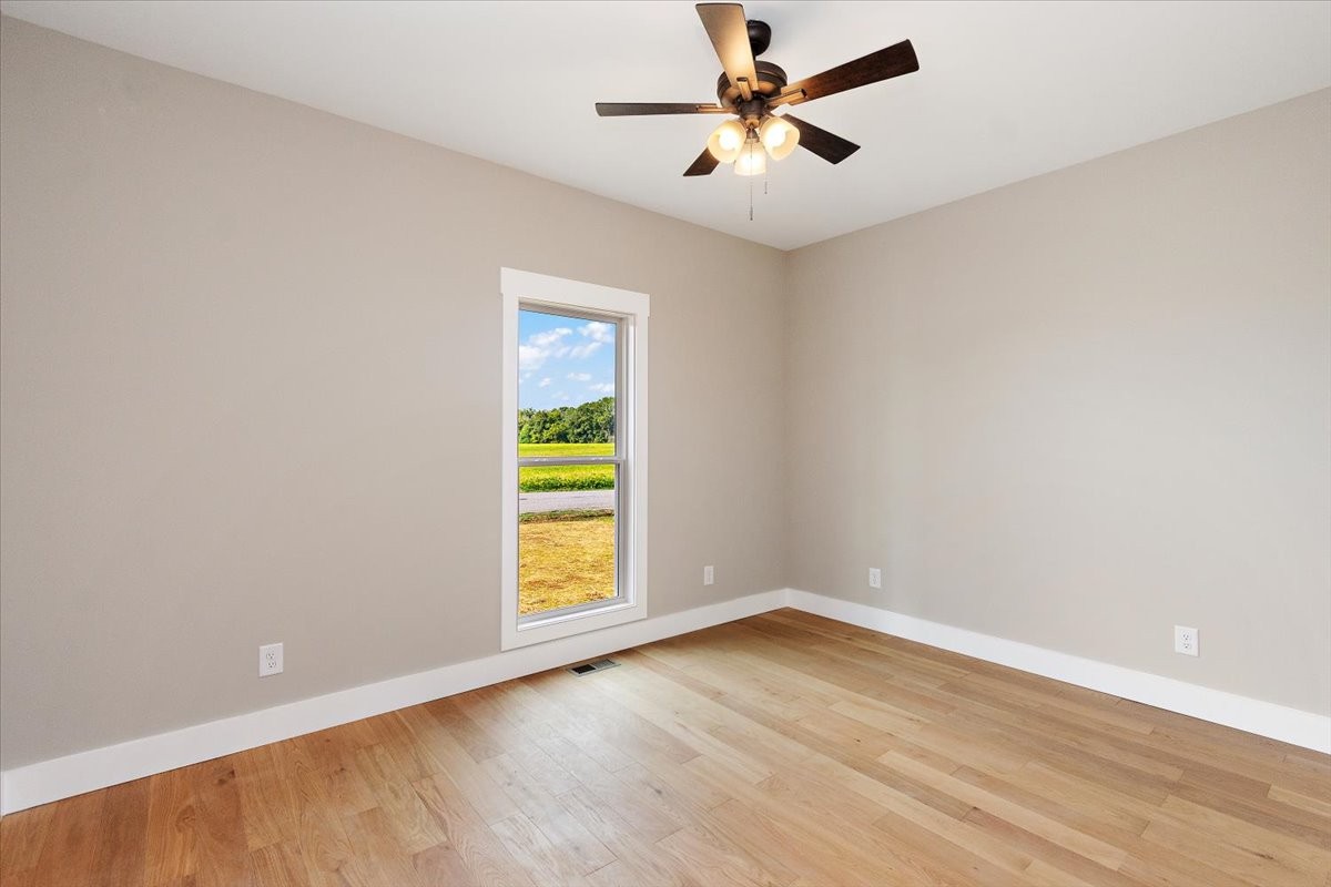 58 Jordan Road Lawrenceburg, TN 38464 - Photo 15 of 31 an empty room with a window and ceiling fan