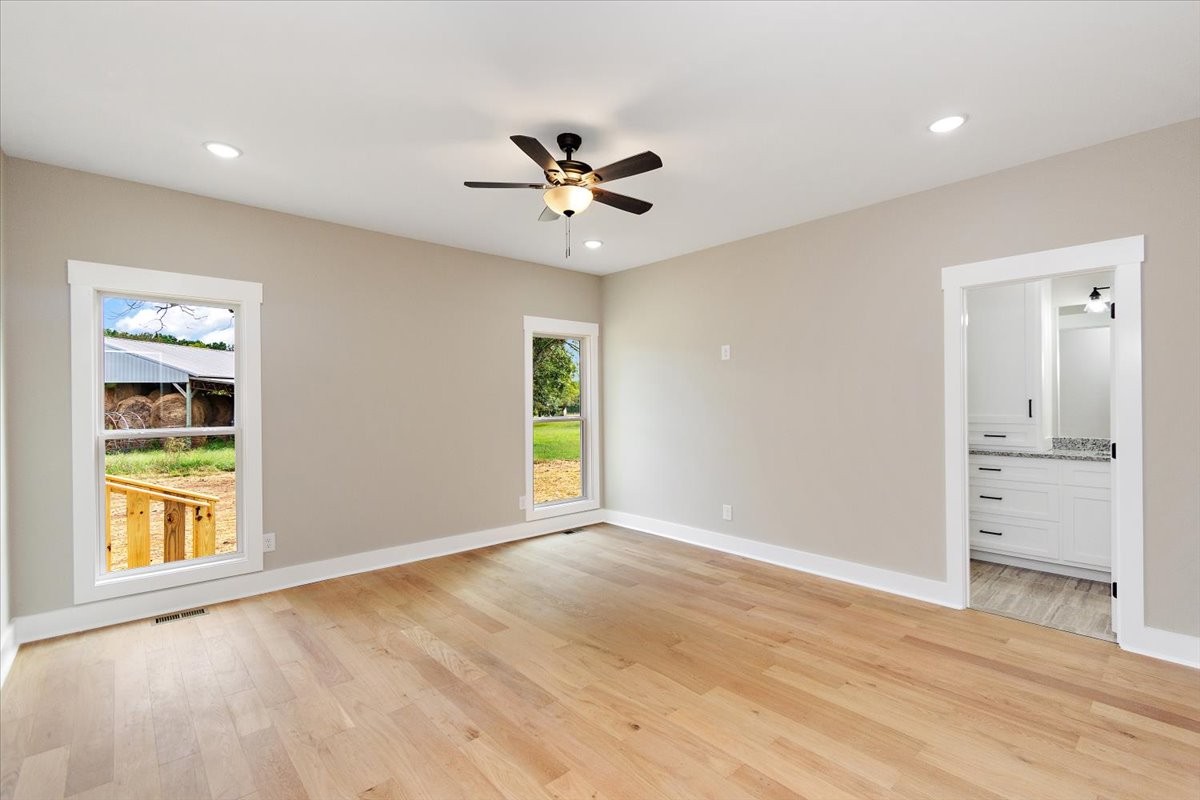 58 Jordan Road Lawrenceburg, TN 38464 - Photo 16 of 31 wooden floor in an empty room with a window