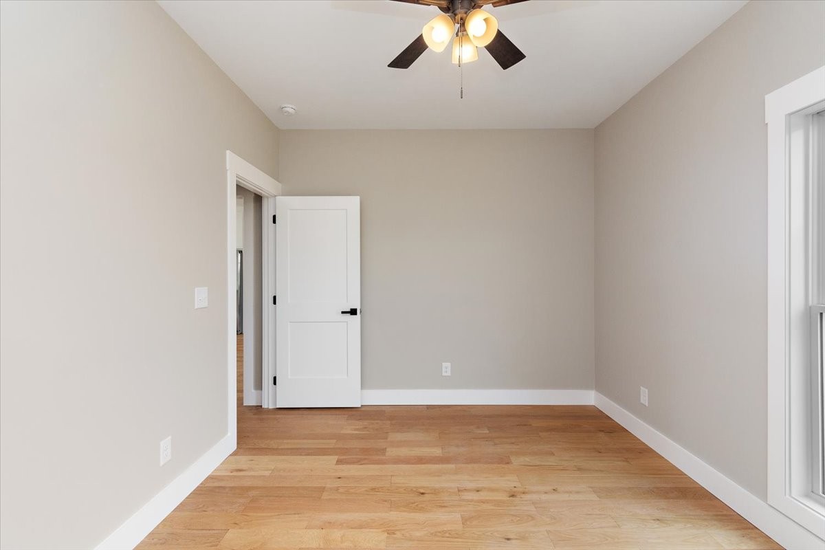58 Jordan Road Lawrenceburg, TN 38464 - Photo 17 of 31 a view of a room with wooden floor and ceiling fan