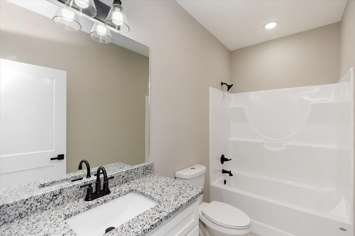 58 Jordan Road Lawrenceburg, TN 38464 - Photo 23 of 31 a bathroom with a sink a toilet and shower
