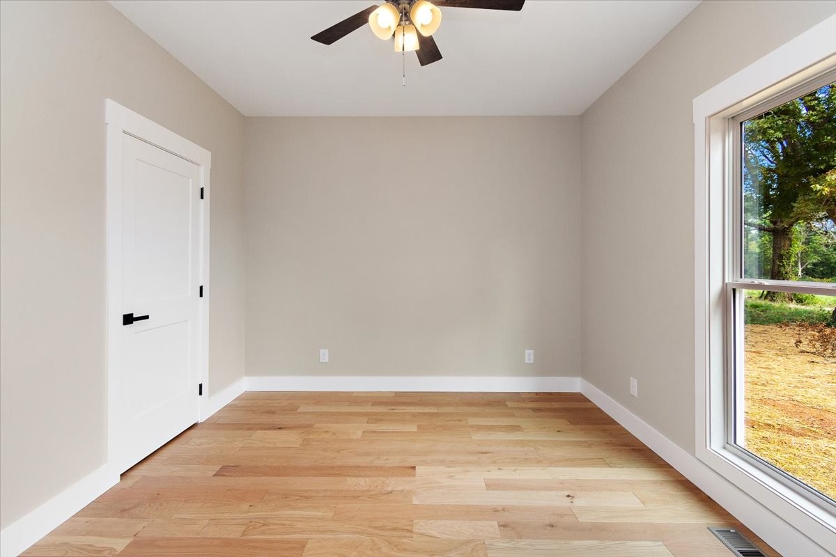 58 Jordan Road Lawrenceburg, TN 38464 - Photo 24 of 31 wooden floor in an empty room with a window