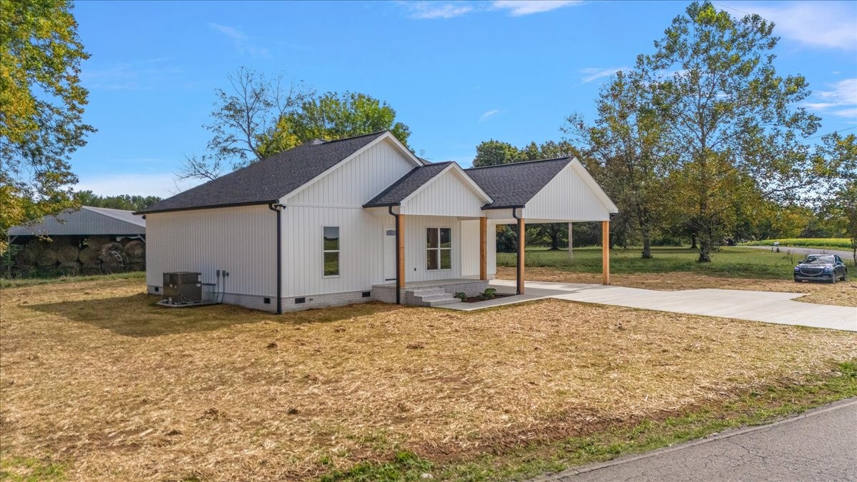 58 Jordan Road Lawrenceburg, TN 38464 - Photo 28 of 31 a house with trees in the background