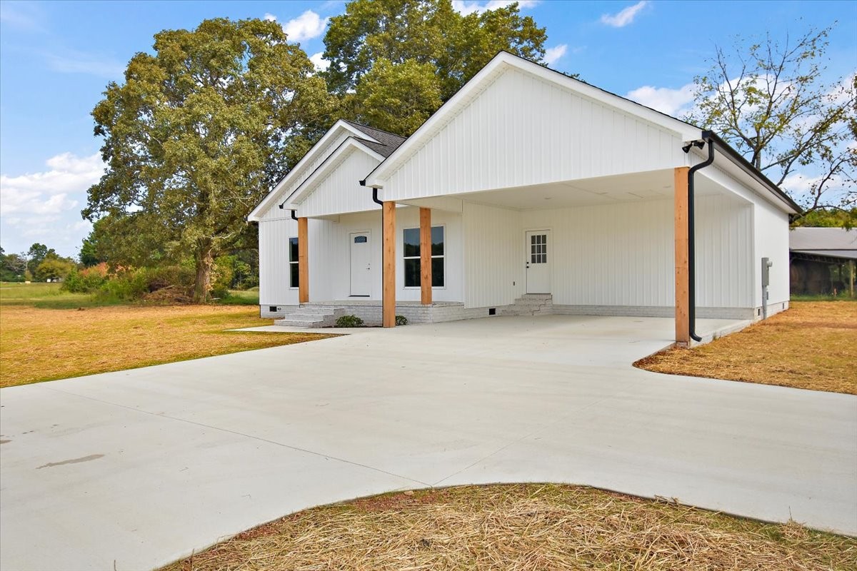 58 Jordan Road Lawrenceburg, TN 38464 - Photo 29 of 31 a view of a house with backyard and tree