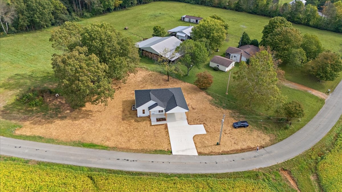 58 Jordan Road Lawrenceburg, TN 38464 - Photo 3 of 31 an aerial view of a house with a yard and lake view