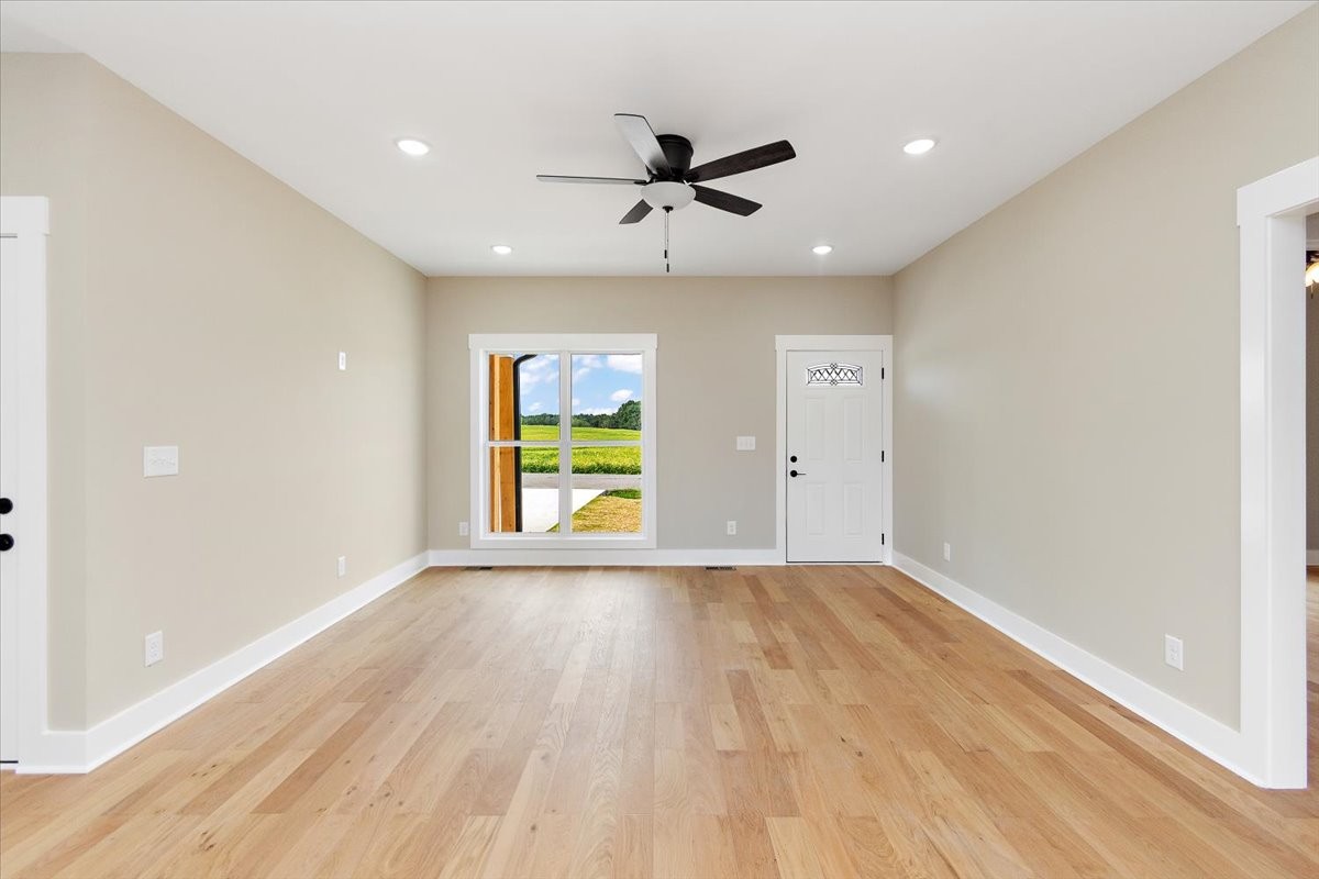 58 Jordan Road Lawrenceburg, TN 38464 - Photo 7 of 31 an empty room with a window and wooden floor