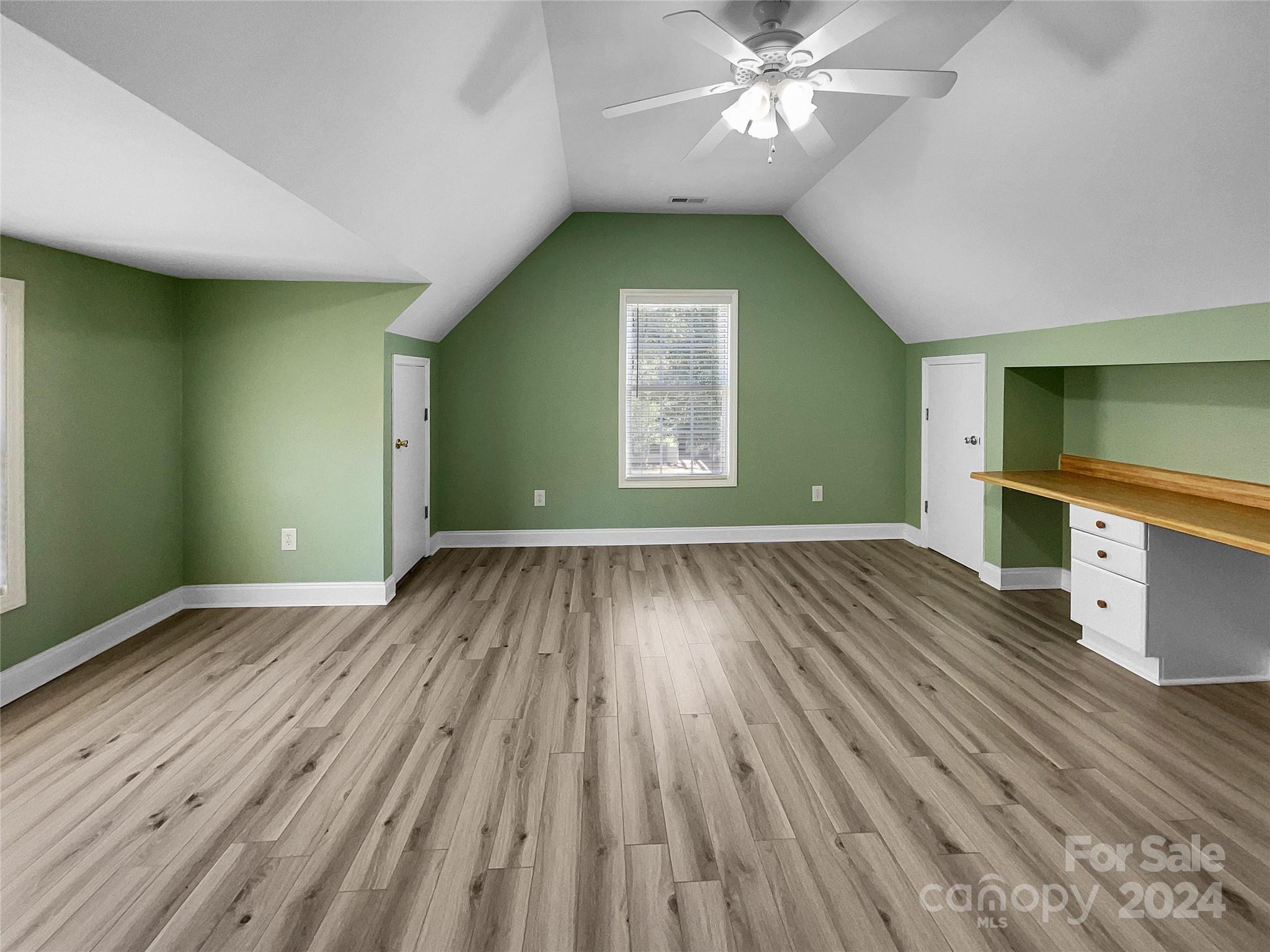 12047 Spinnaker Drive Fort Mill, SC 29708 - Photo 13 of 17 wooden floor in an empty room with a window