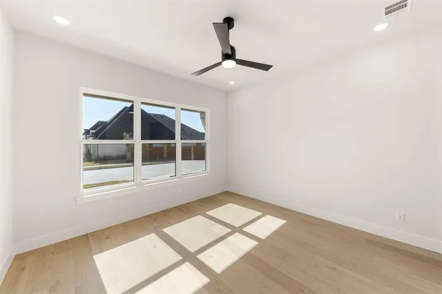 a bathroom with a sink a toilet and a large mirror