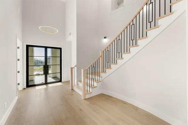 a view of an entryway with wooden floor