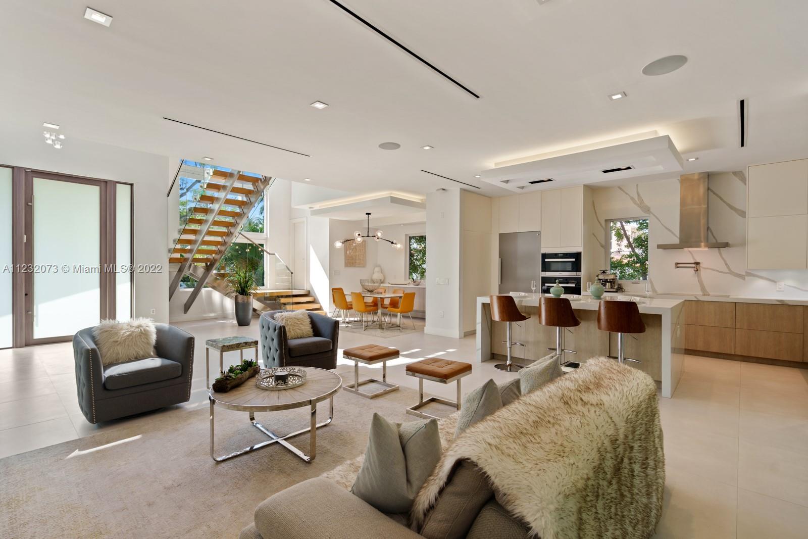 4610 Alton Road Miami Beach, FL 33140 - Photo 11 of 38 a living room with furniture and a large window