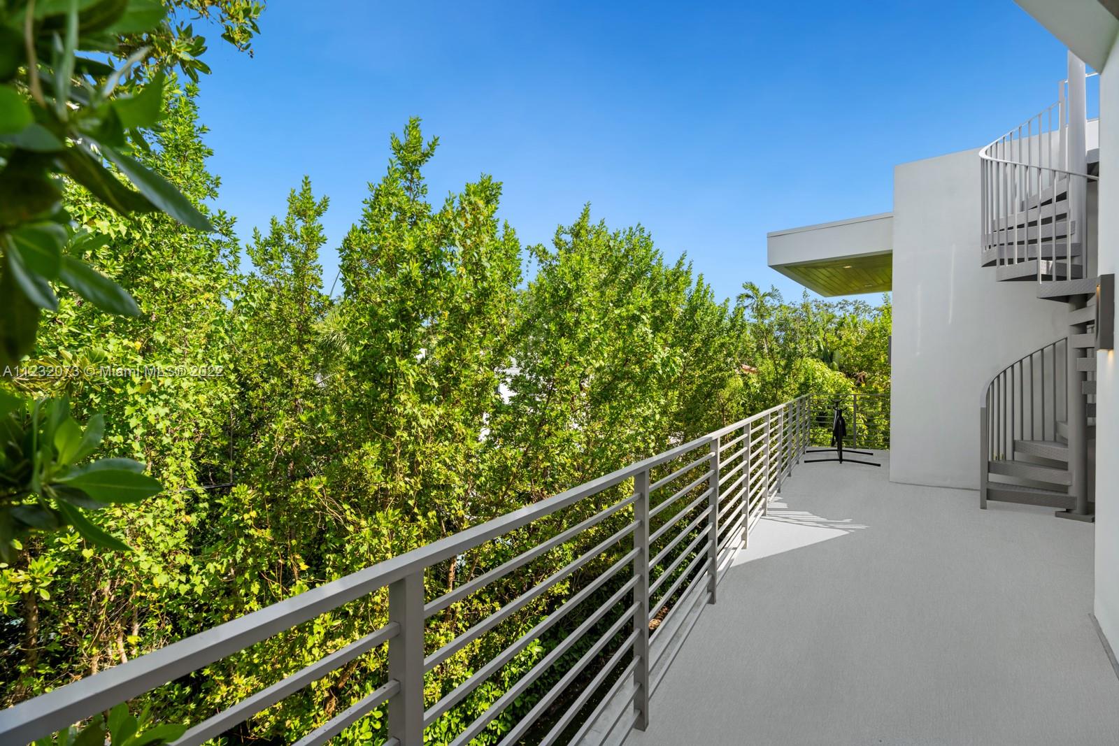 4610 Alton Road Miami Beach, FL 33140 - Photo 27 of 38 a view of a balcony with wooden stairs