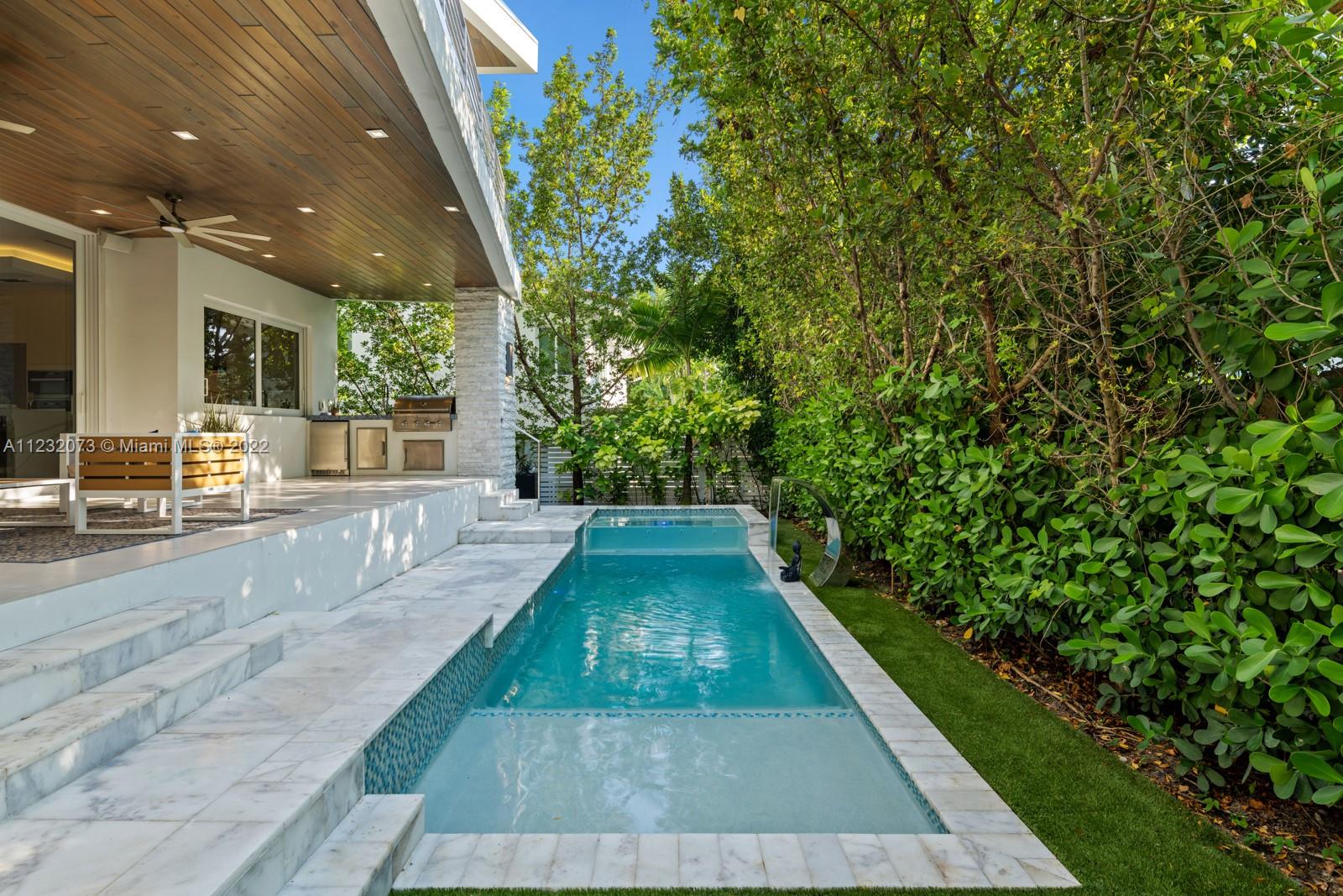 4610 Alton Road Miami Beach, FL 33140 - Photo 35 of 38 a view of a backyard with potted plants