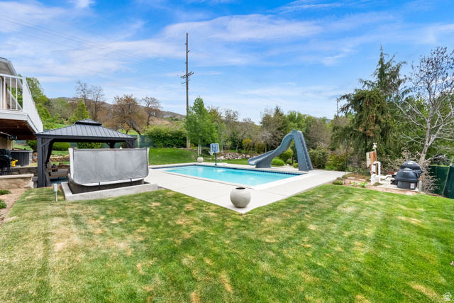 1506 Lakeview Drive Bountiful, UT 84010 - Photo 51 of 58 Swimming pool featuring a water slide, a patio area, a gazebo, and a lawn