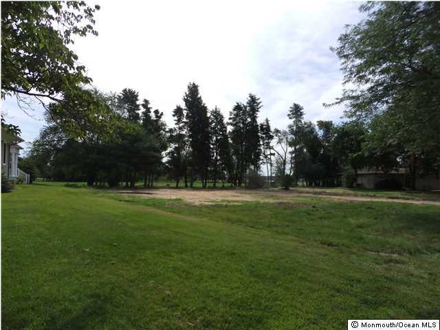 102 Flag Point Road Toms River, NJ 08753 - Photo 4 of 13 a view of field with trees in the background