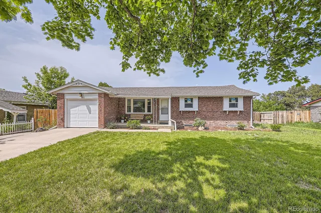 a front view of a house with swimming pool having outdoor seating